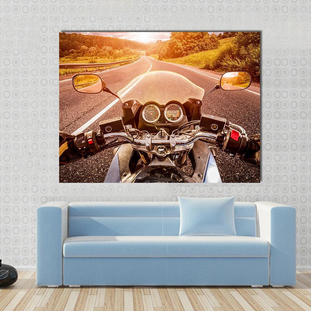 Motorcycle Pov at Sunset Canvas Wall Art in black, orange and yellow, single panel hung on a wall