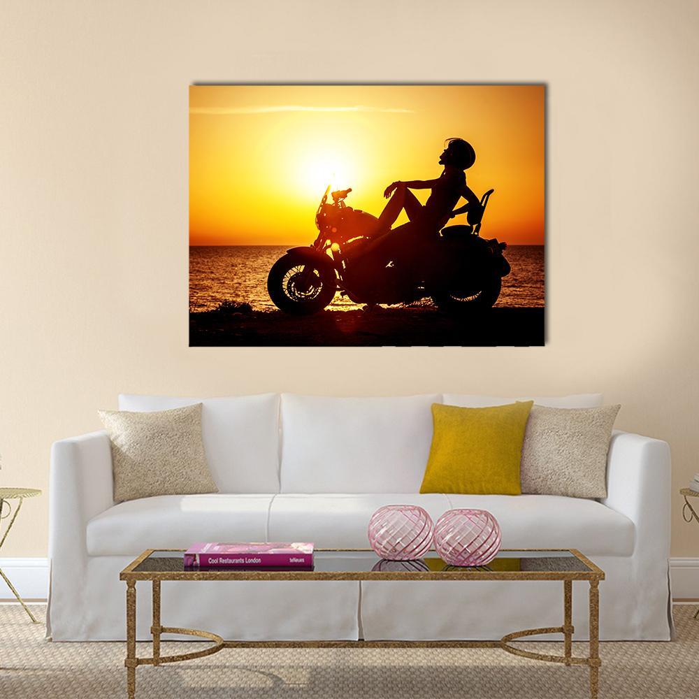 Coastal Motorcycle at Sunset Canvas Wall Art in black, orange and yellow, single panel hung on a wall
