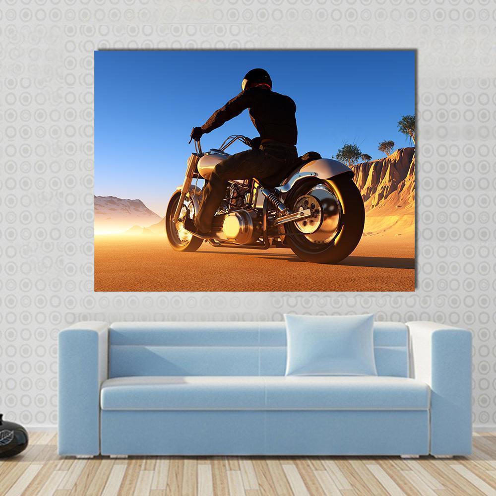 Bike Rider in Desert Canvas Wall Art in brown, orange and blue, single panel hung on a wall