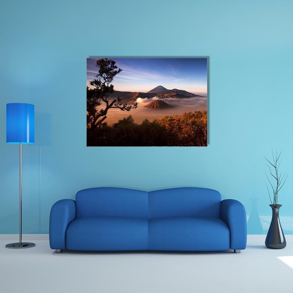 Mount Bromo Sunrise Over Volcanoes Canvas Wall Art in brown, orange and blue, single panel hung on a wall