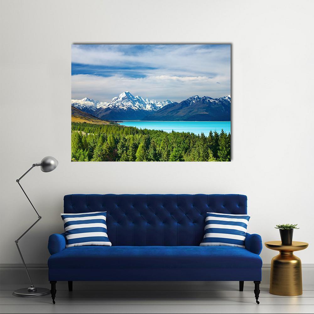 Mount Cook and Pukaki Lake Canvas Wall Art in white, green and blue, single panel hung on a wall
