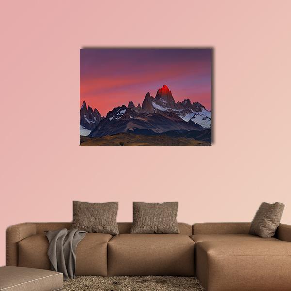 Mount Fitz Roy at Sunset Canvas Wall Art in orange, purple and pink, single panel hung on a wall