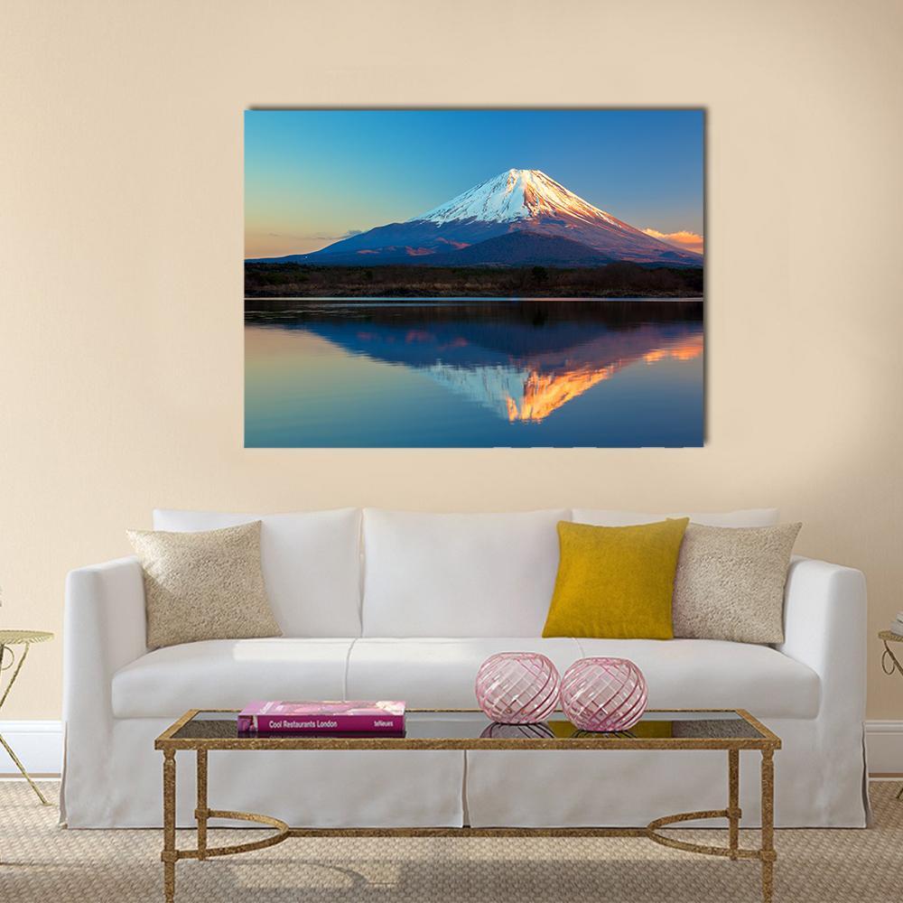 Snow-capped Mount Fuji Reflection in Lake Shoji Canvas Wall Art in white, orange and blue, single panel hung on a wall