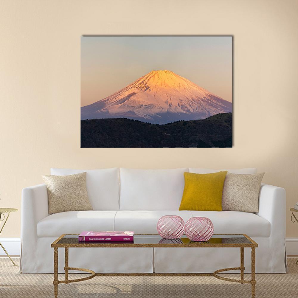 Snow-capped Mount Fuji at Sunrise Canvas Wall Art in white, gray and orange, single panel hung on a wall