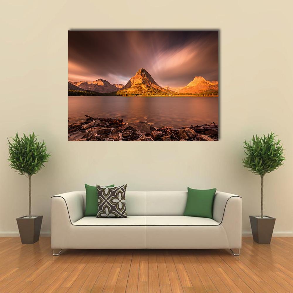 Mount Grinnell at Sunrise Canvas Wall Art in beige, brown and orange, single panel hung on a wall