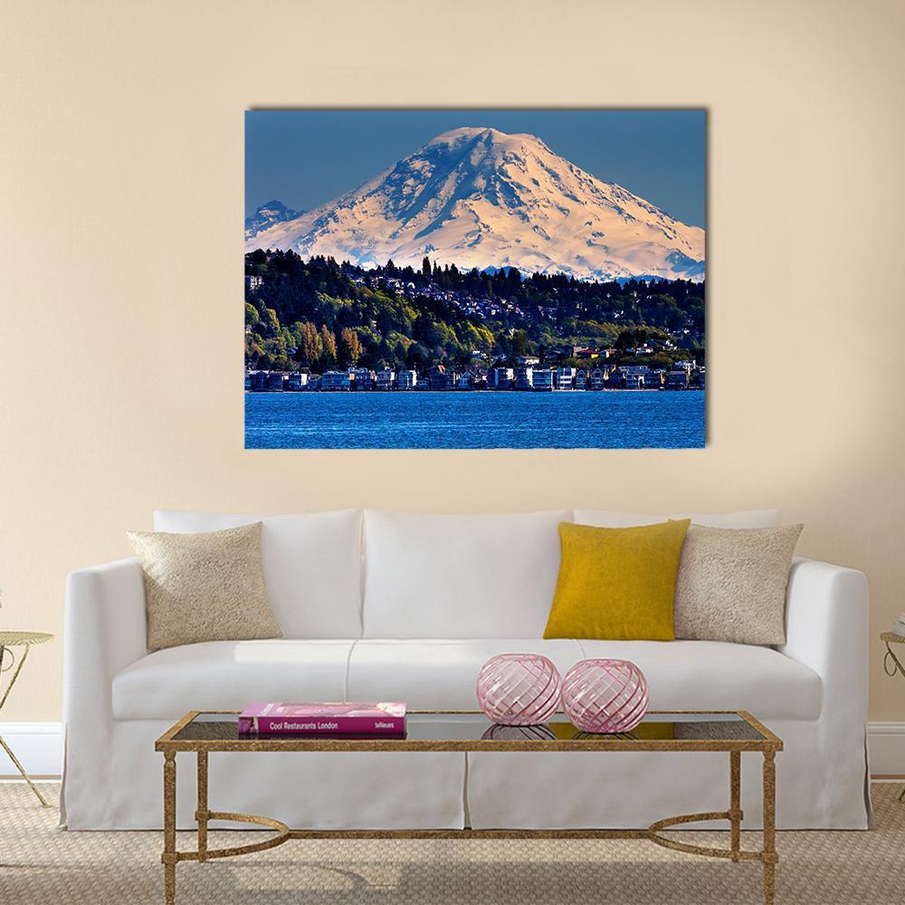 Mount Rainier Above Coastal Town Canvas Wall Art in white, green and blue, single panel hung on a wall