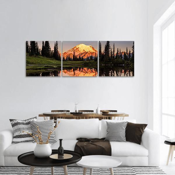 Mount Rainier Reflection at Sunset Panoramic Canvas Wall Art in brown, orange and green, hung on a wall