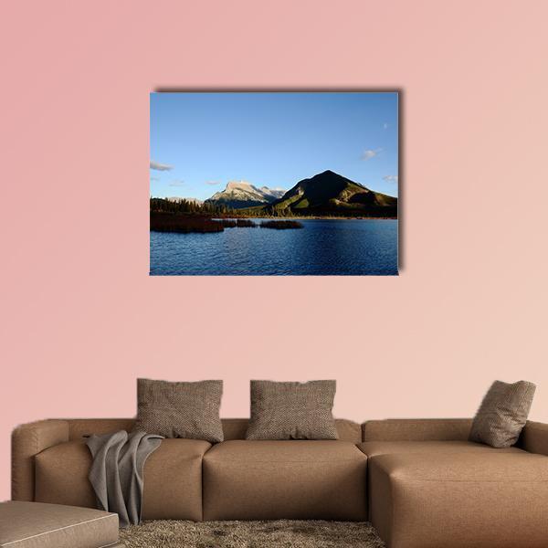 Mount Rundle and Vermilion Lake Canvas Wall Art in brown, green and blue, single panel hung on a wall