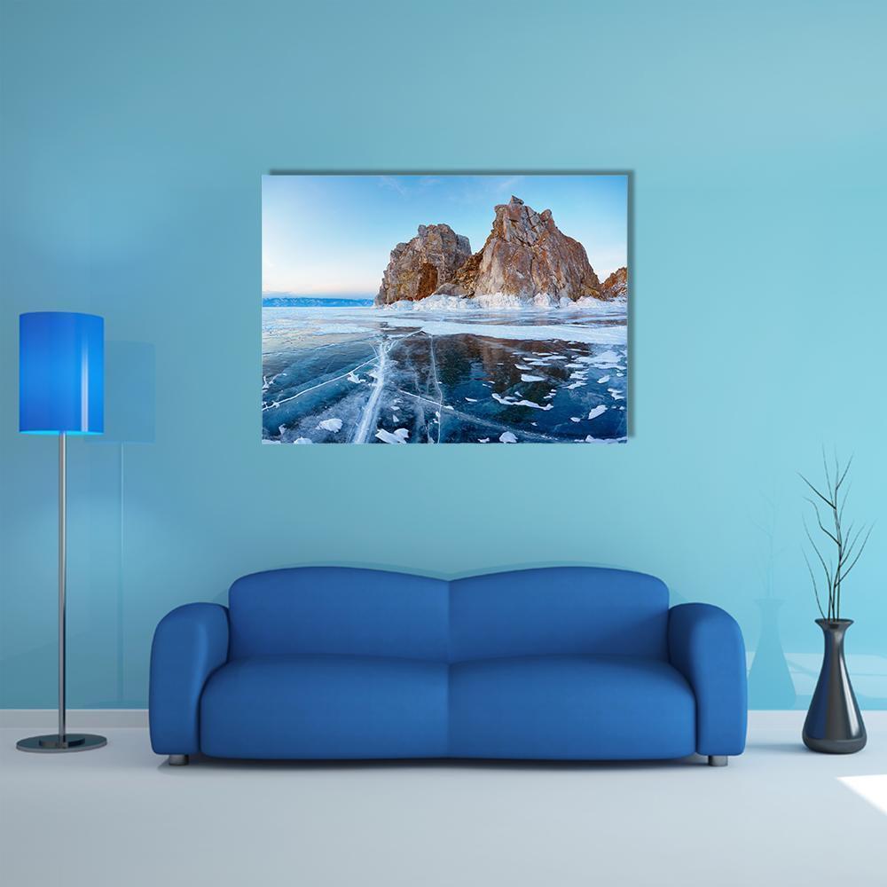 Frozen Lake with Ice Cracks and Rocky Islands Canvas Wall Art in white, brown and blue, single panel hung on a wall