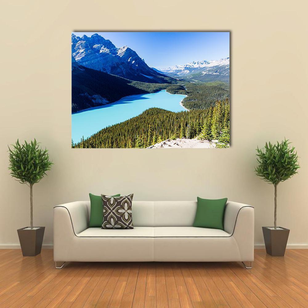 Majestic Glacier Lake and Mountain Landscape Canvas Wall Art in white, green and blue, single panel hung on a wall