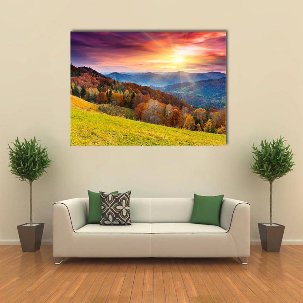 Colorful Mountain at Sunset Canvas Wall Art in orange, yellow and purple, single panel hung on a wall
