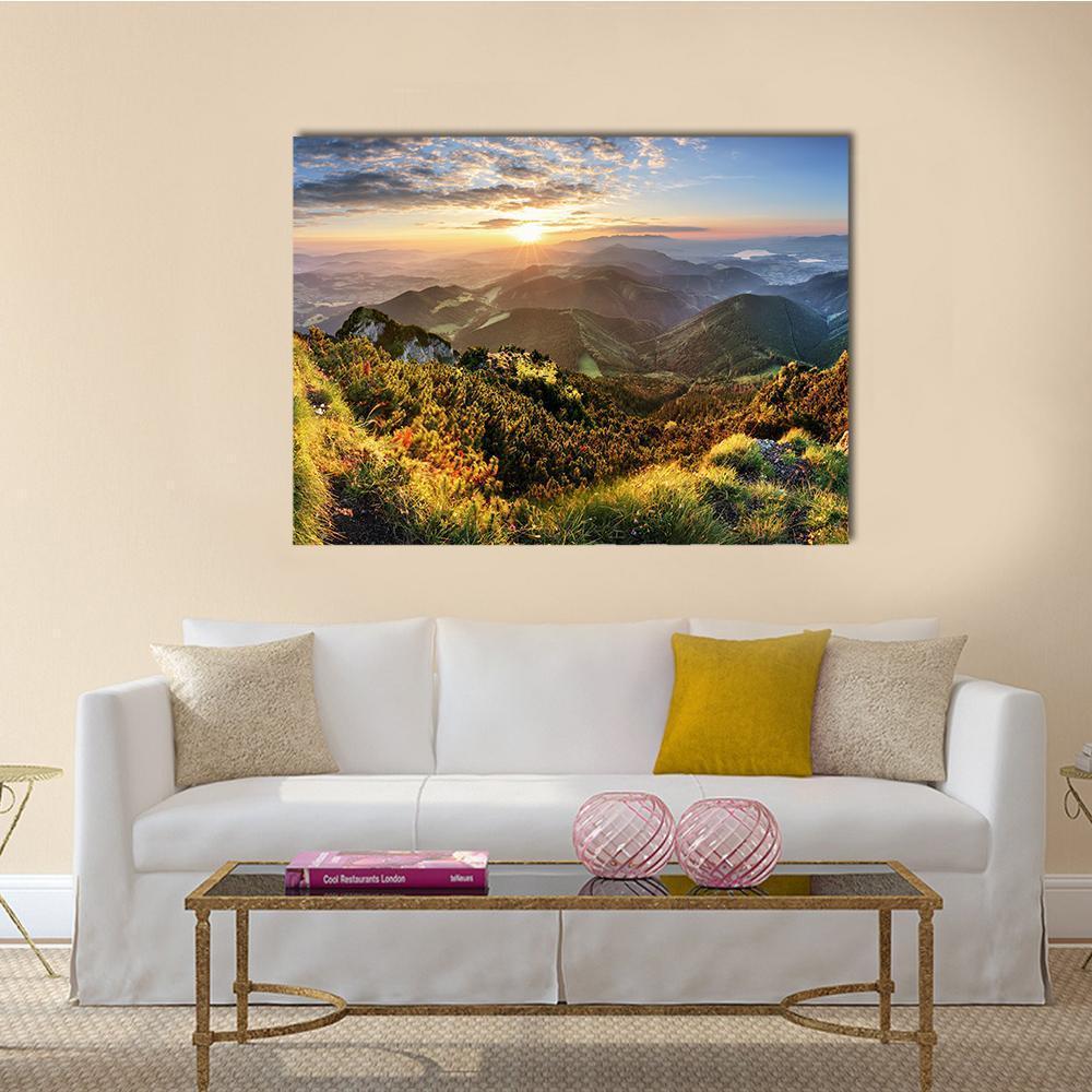 Sunlit Mountain Forest Canvas Wall Art in yellow, green and blue, single panel hung on a wall