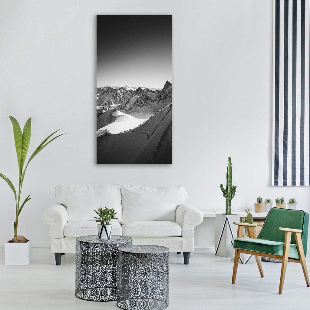 Mountain Highland Vertical Canvas Wall Art in black, white and gray, single vertical panel hung on a wall