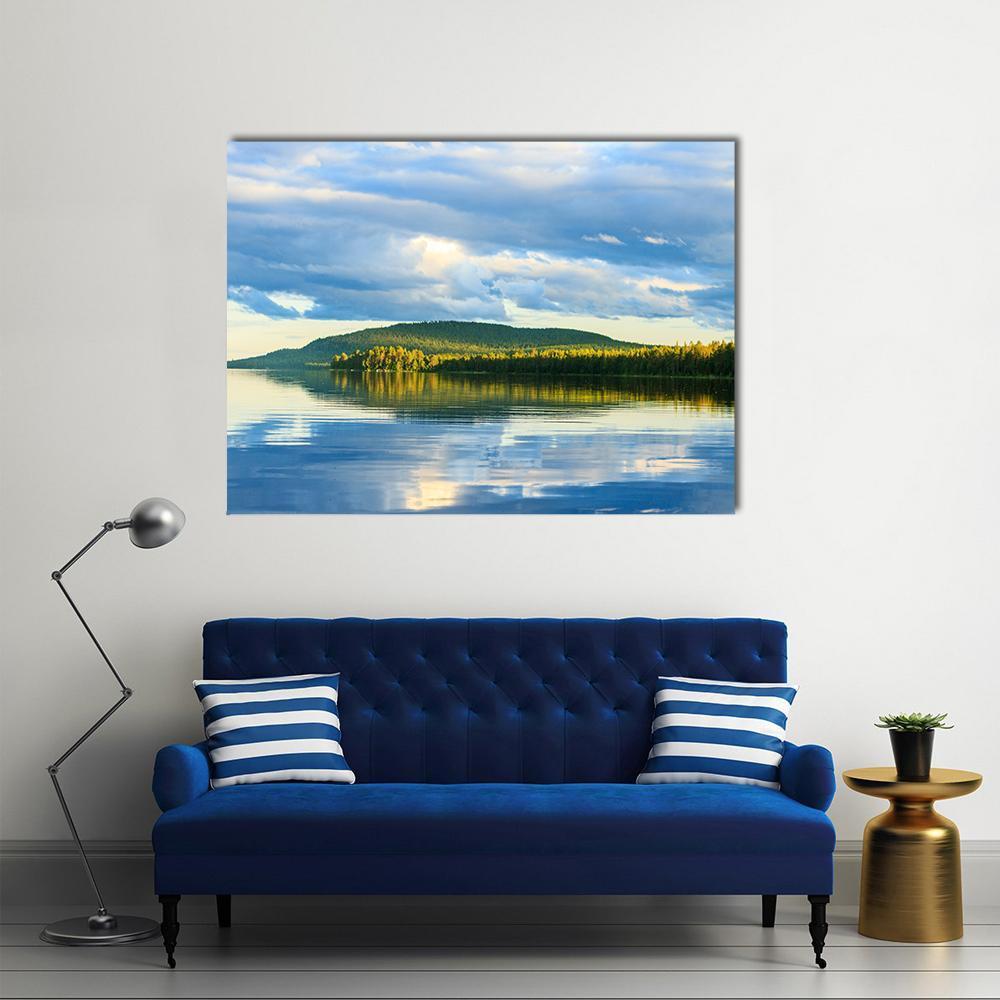 Lake with Striking Cloud Reflections Canvas Wall Art in white, green and blue, single panel hung on a wall
