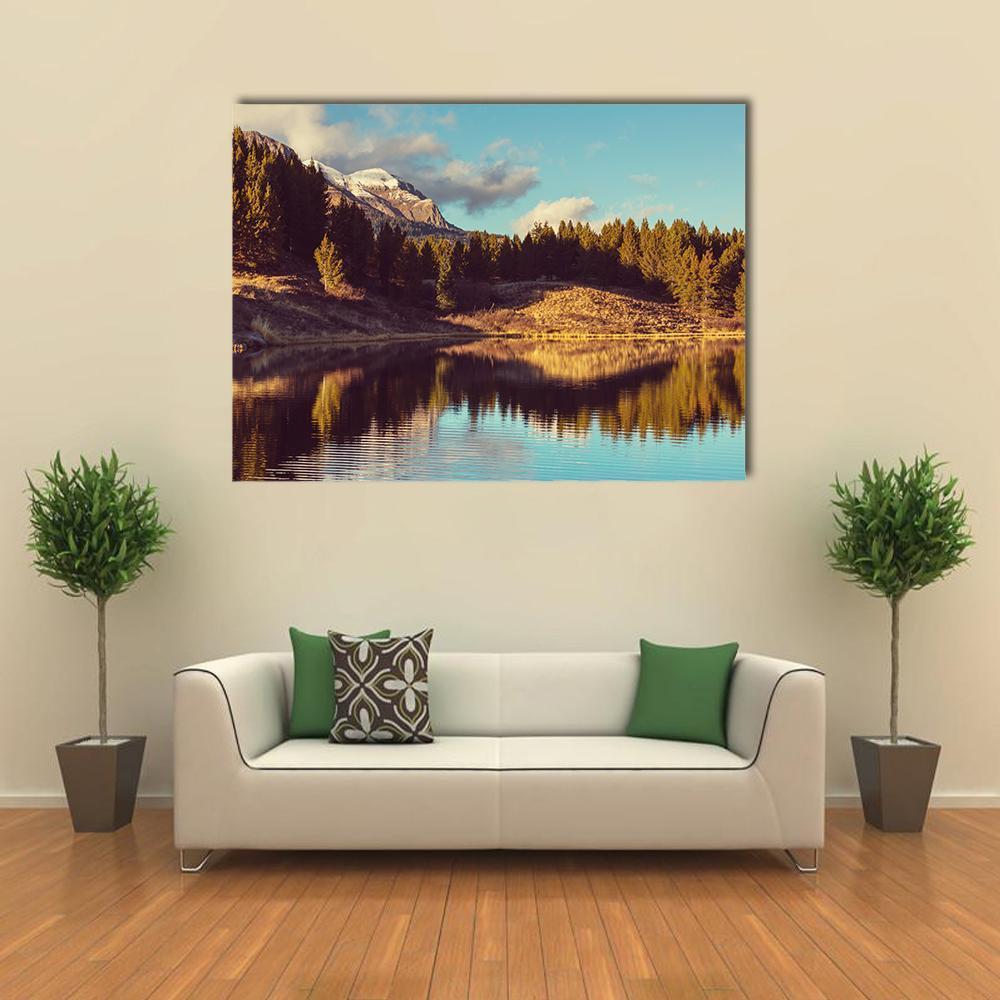 Mountain Lake Reflection in Autumn Canvas Wall Art in brown, yellow and blue, single panel hung on a wall