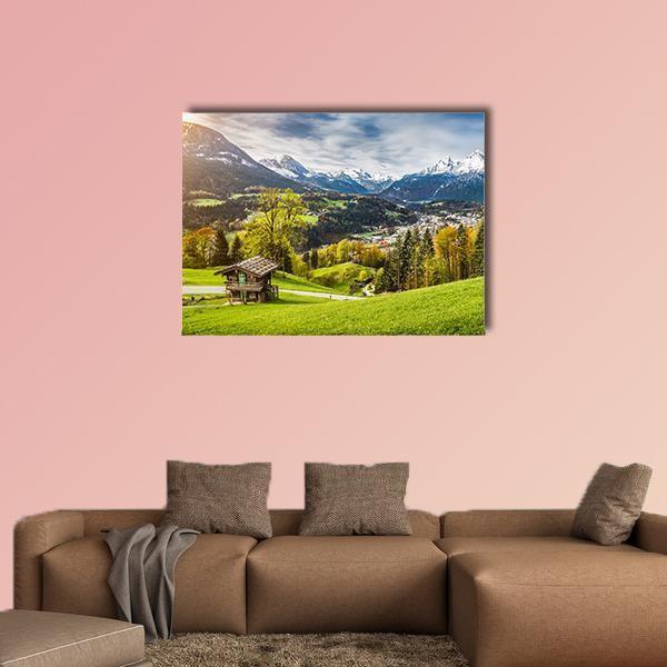 Bavarian Alpine Village with Snow-capped Peaks Canvas Wall Art in white, green and blue, single panel hung on a wall