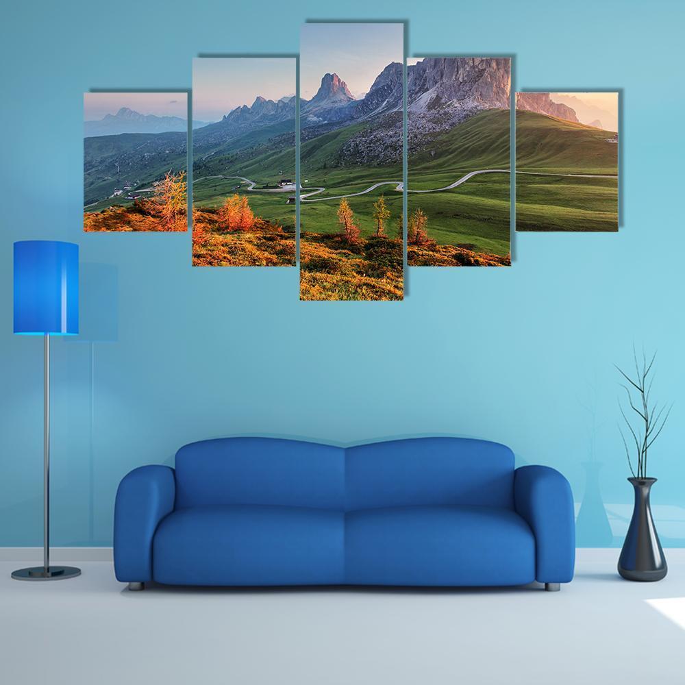 Dolomites Winding Road at Sunset Canvas Wall Art in orange, green and blue, 5 panel Star layout hung on a wall