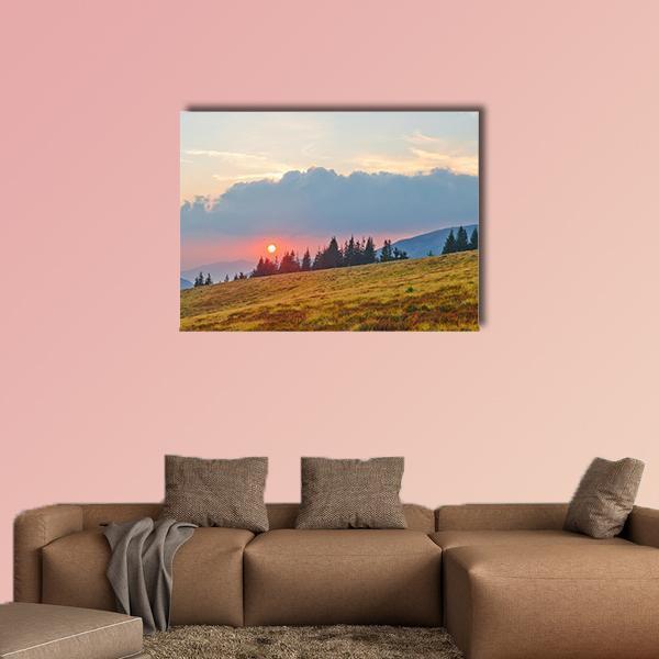 Golden Sunset Over Rolling Mountains Canvas Wall Art in gold, yellow and blue, single panel hung on a wall