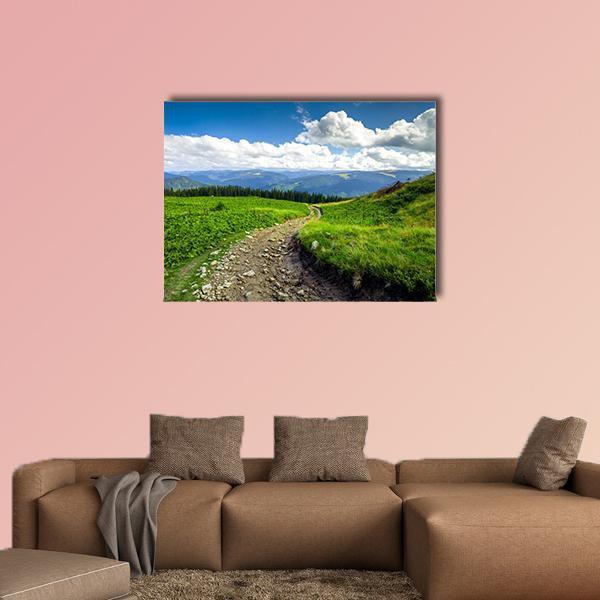 Gravel Path Through Green Mountain Hills Canvas Wall Art in gray, green and blue, single panel hung on a wall