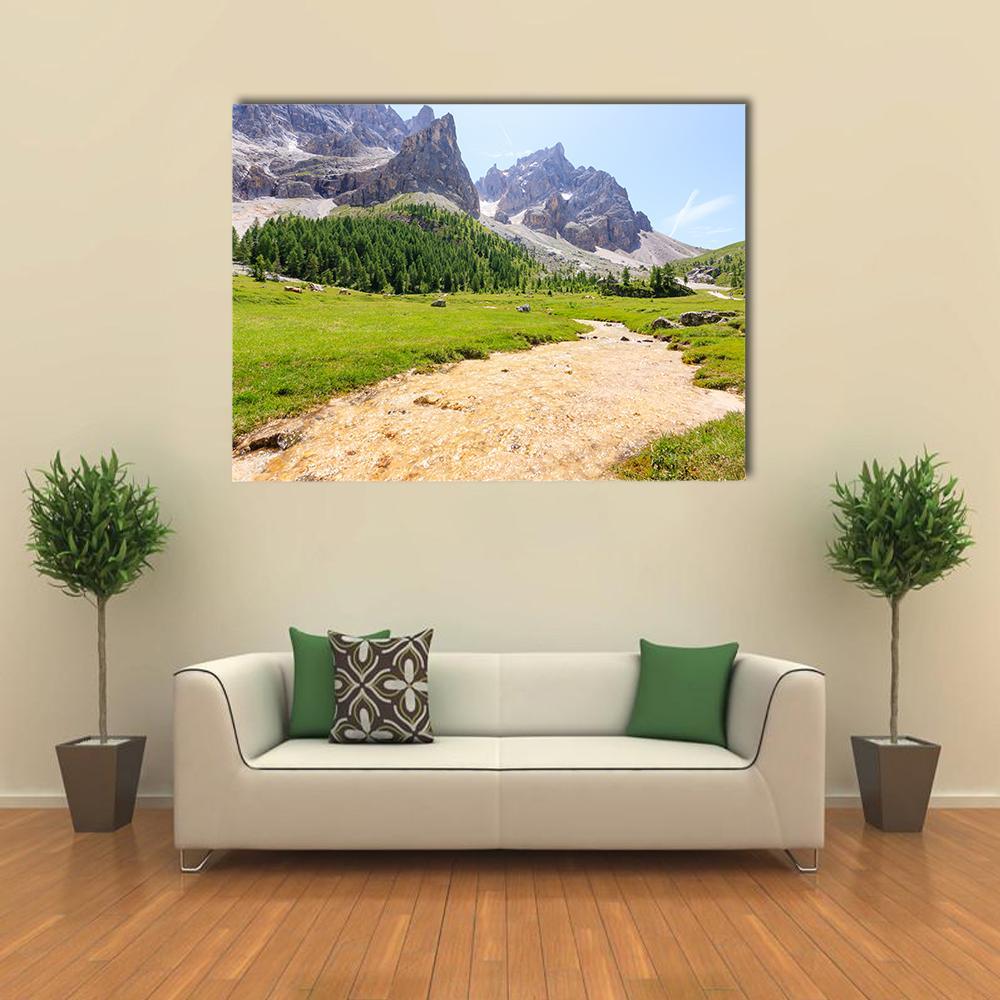 Alpine Peaks with Winding Stream Canvas Wall Art in gray, green and blue, single panel hung on a wall