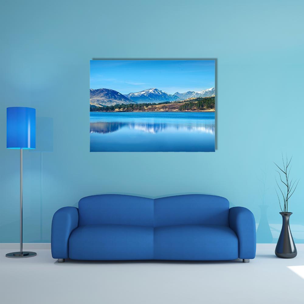 Lake Reflection in the Scottish Highlands Canvas Wall Art in white, brown and blue, single panel hung on a wall