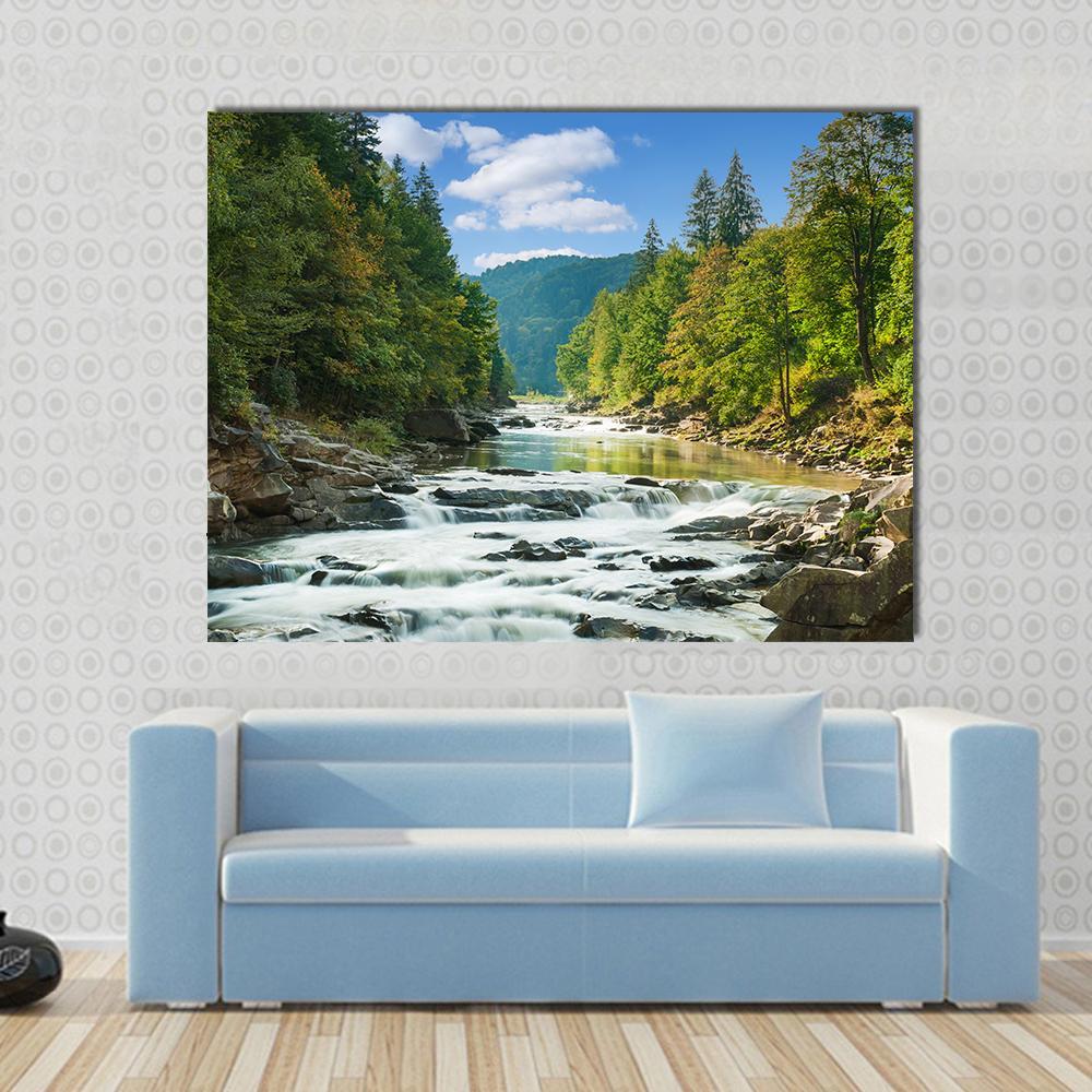 River in Forest Canvas Wall Art in white, green and blue, single panel hung on a wall