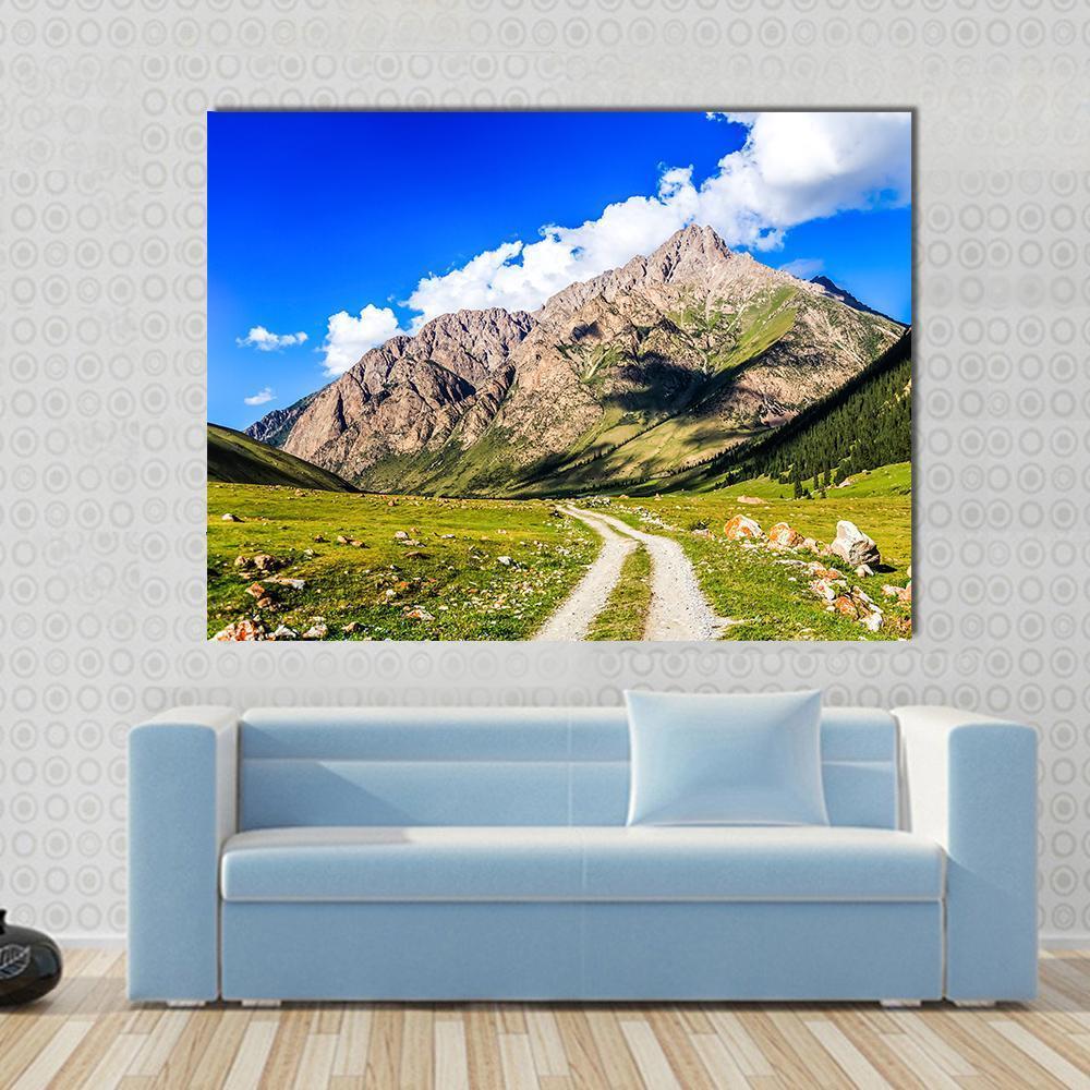 Mountain Road Landscape Canvas Wall Art in brown, green and blue, single panel hung on a wall