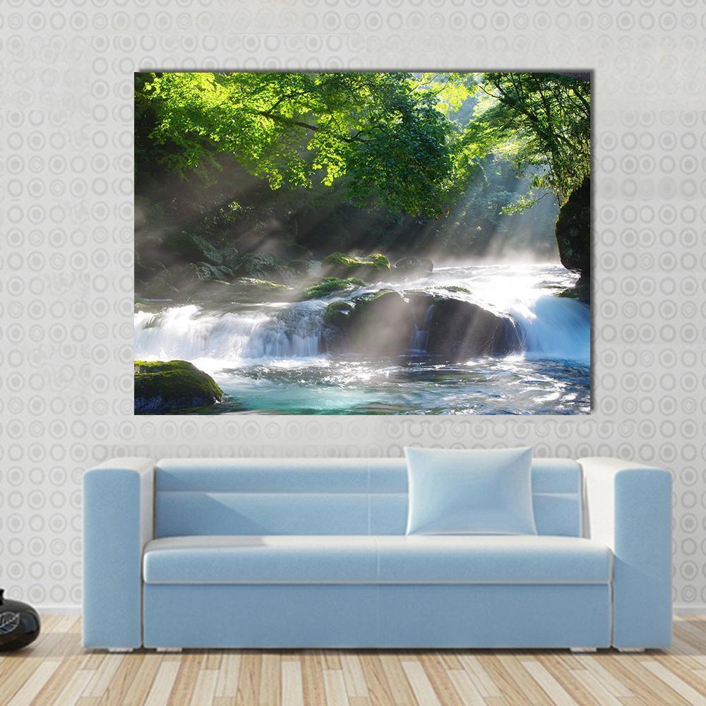 Sunlight on Mountain Stream Canvas Wall Art in white, green and blue, single panel hung on a wall