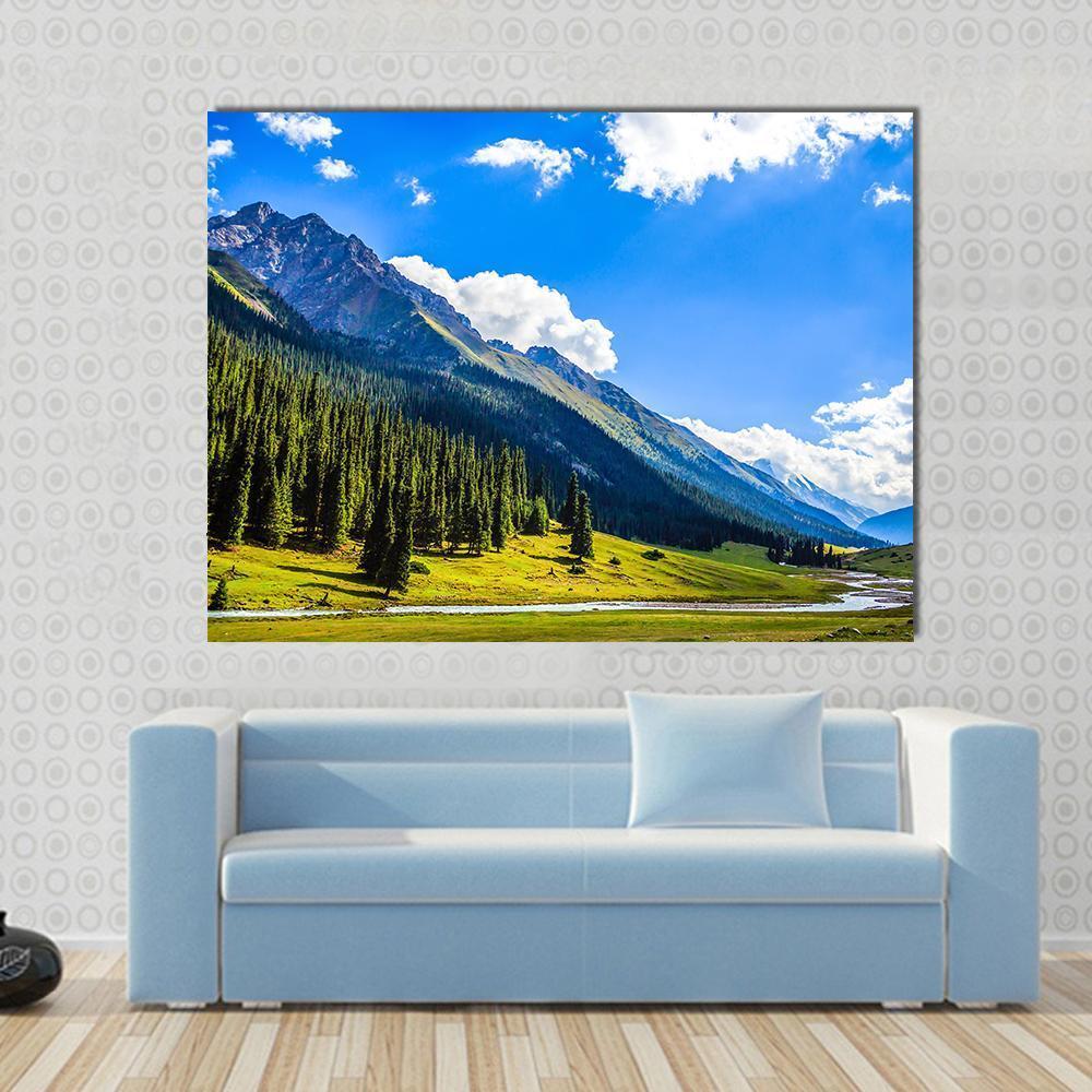 Mountain Summit Landscape Canvas Wall Art in white, green and blue, single panel hung on a wall
