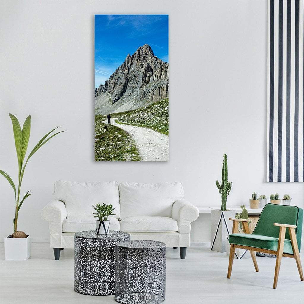 Mountain Trail in Summer Vertical Canvas Wall Art in gray, green and blue, single vertical panel hung on a wall
