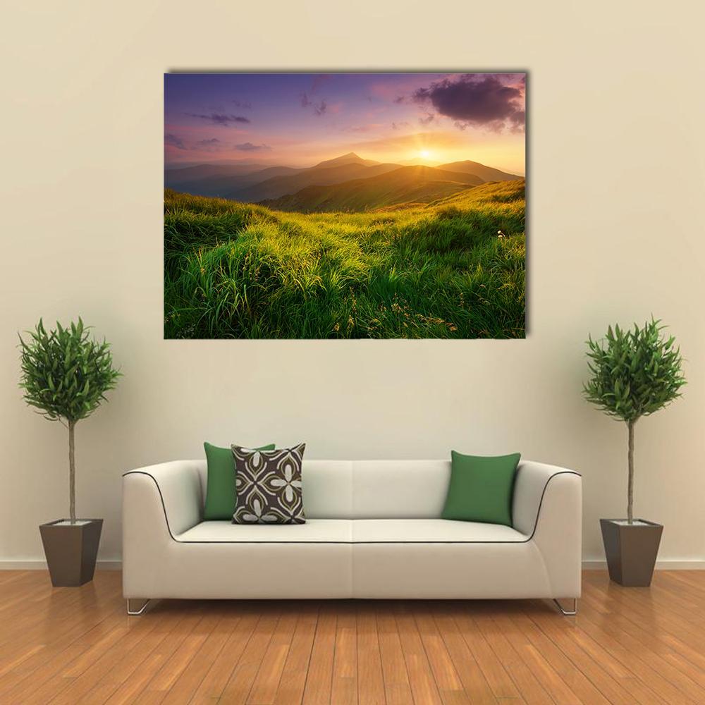 Sunrise on Mountain Valley Canvas Wall Art in yellow, green and purple, single panel hung on a wall