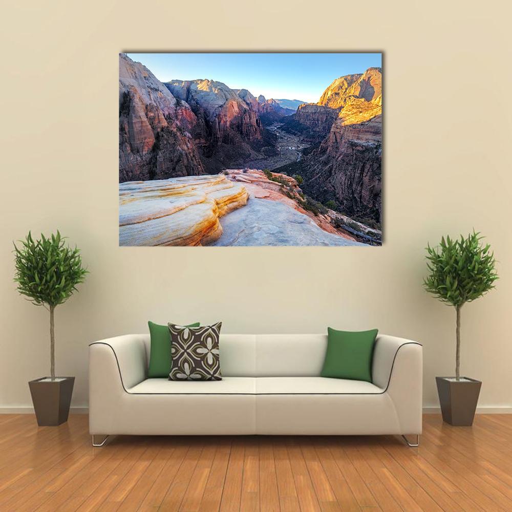 Mountain Valley with Layered Sandstone Canvas Wall Art in brown, orange and blue, single panel hung on a wall
