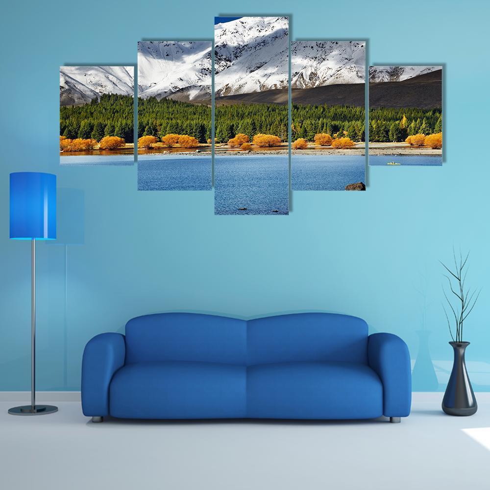 Snow-capped Mountain Over Lake Tekapo Canvas Wall Art in white, green and blue, 5 panel Star layout hung on a wall