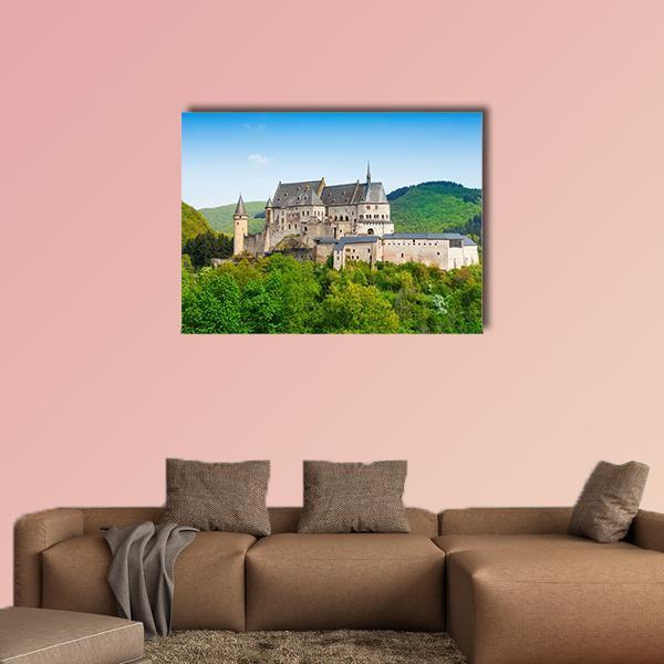 Stone Castle on Green Hills Canvas Wall Art in gray, green and blue, single panel hung on a wall