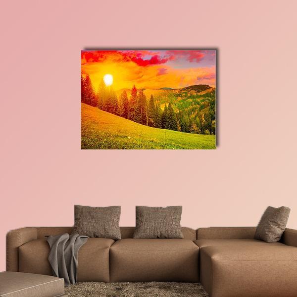 Sunlit Mountain at Sunset Canvas Wall Art in orange, yellow and green, single panel hung on a wall