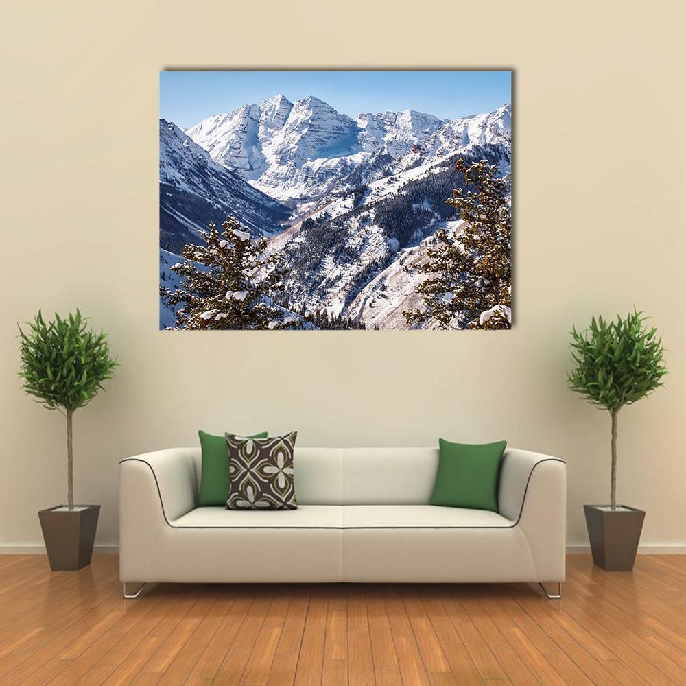 Snowy Mountains of Maroon Bells Canvas Wall Art in white, gray and blue, single panel hung on a wall