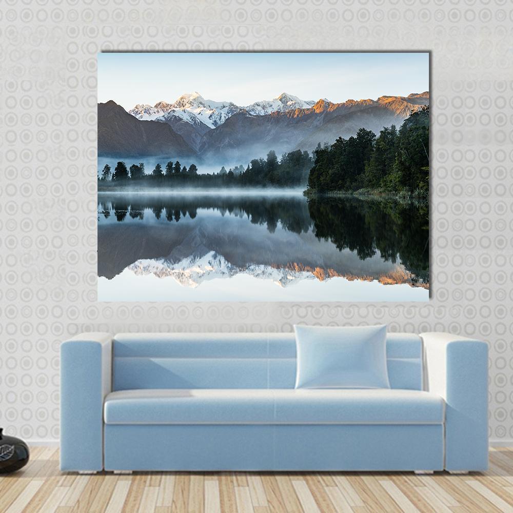 Mountains Reflection in Lake Canvas Wall Art in white, gray and blue, single panel hung on a wall