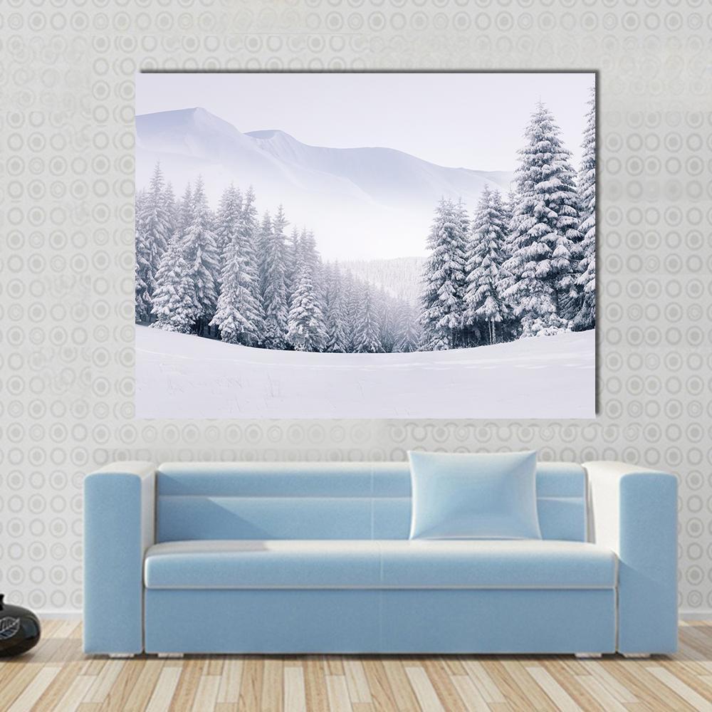 Mountain Top in Winter Canvas Wall Art in white, gray and blue, single panel hung on a wall