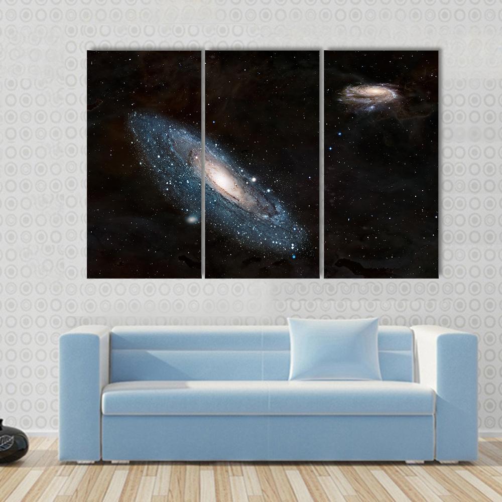 Andromeda Galaxy and Milky Way Canvas Wall Art in black and blue, 3 panel horizontal set hung on a wall