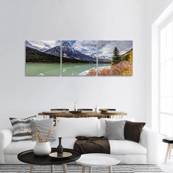 Mt Chephren Autumn Lake View Panoramic Canvas Wall Art in gray, green and blue, hung on a wall