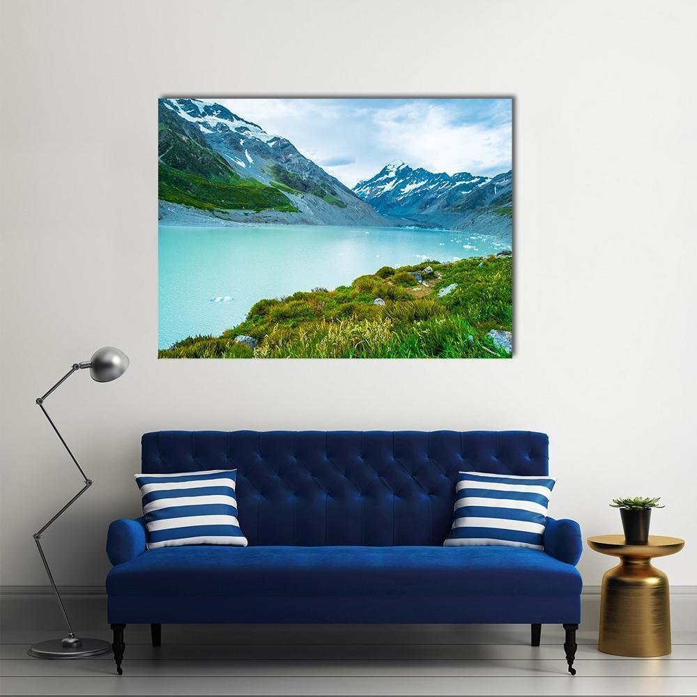Milky Turquoise Glacial Lake and Rugged Peaks Canvas Wall Art in gray, green and blue, single panel hung on a wall