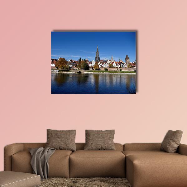 Muenster Tower and Danube in Autumn Canvas Wall Art in white, brown and blue, single panel hung on a wall