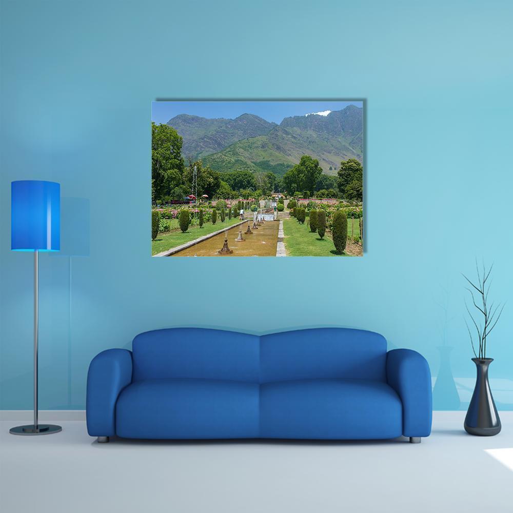Mughal Garden in Srinagar with Snow-capped Mountains Canvas Wall Art in brown, green and blue, single panel hung on a wall