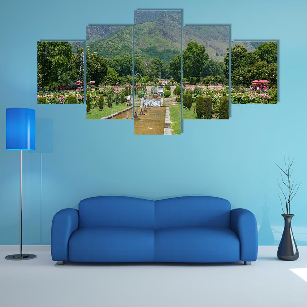 Mughal Garden in Srinagar with Snow-capped Mountains Canvas Wall Art in brown, green and blue, 5 panel Star layout hung on a wall