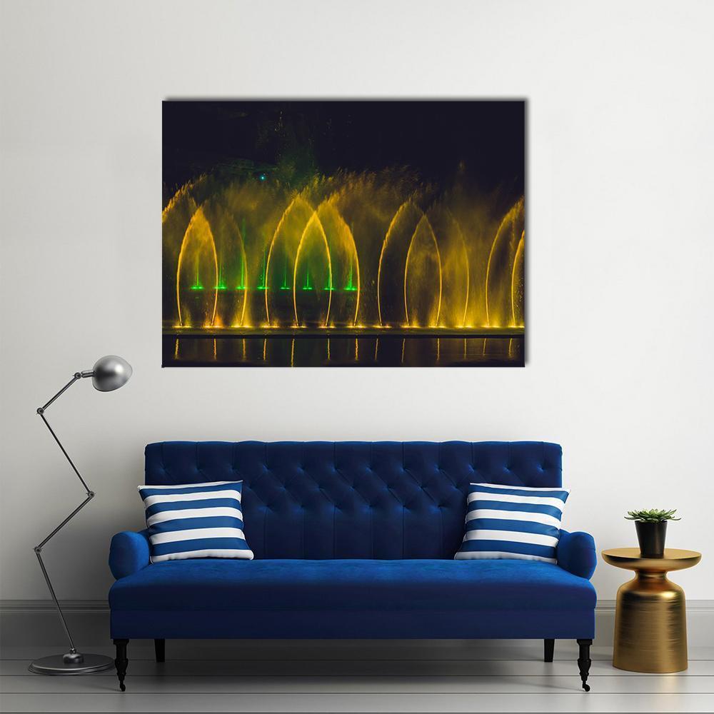 Vibrant Yellow Dancing Fountains Canvas Wall Art in black and yellow, single panel hung on a wall