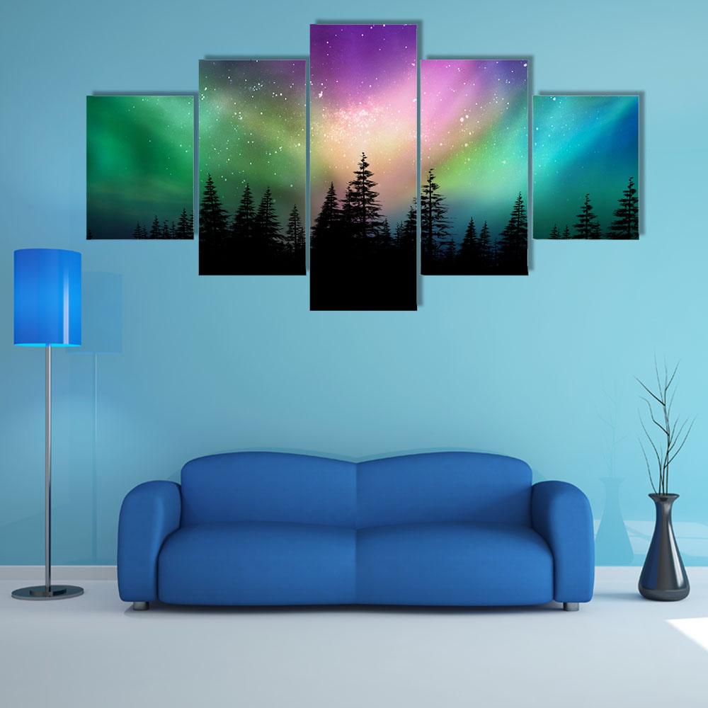 Aurora Borealis Over Pine Forest Canvas Wall Art in black, green and purple, 5 panel Pop layout hung on a wall