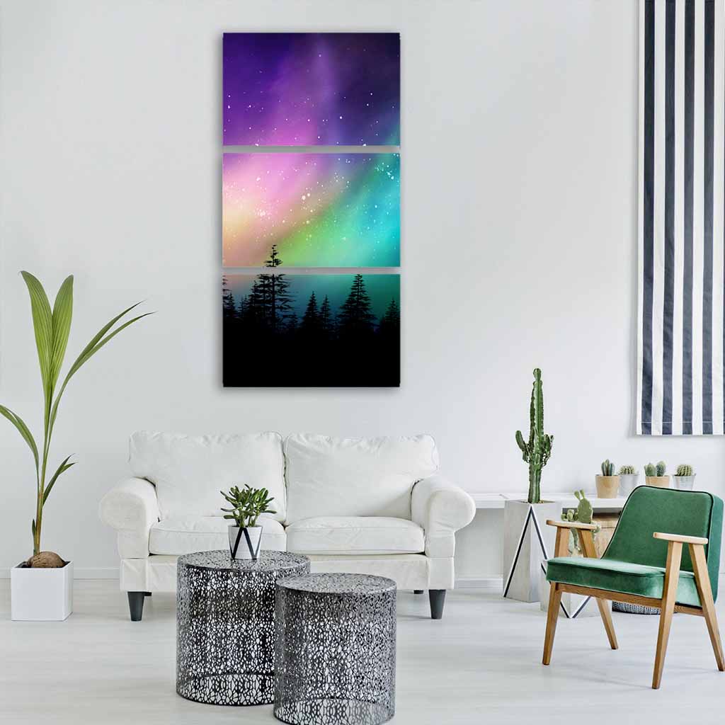 Multicolored Northern Lights Over Pine Forest Vertical Canvas Wall Art in black, green and purple, single vertical panel hung on a wall