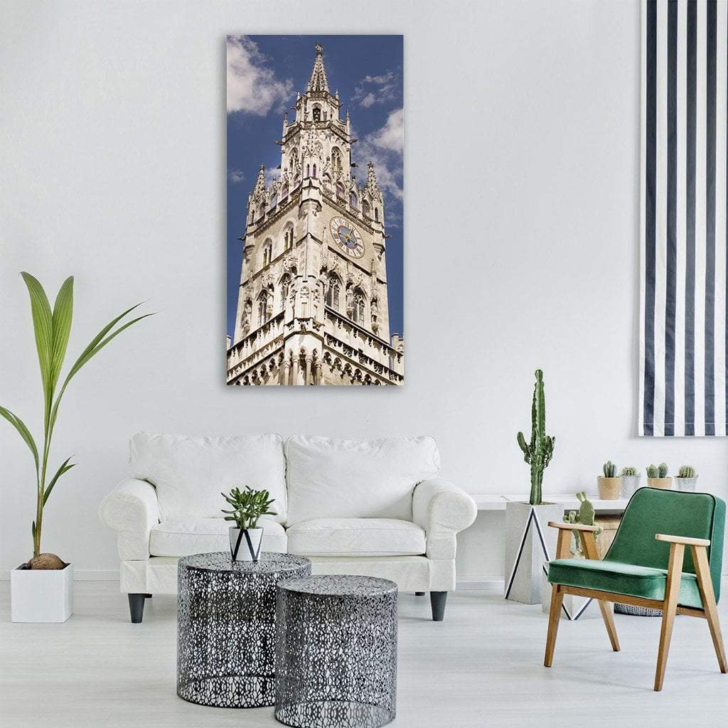 Munich Clock Tower Vertical Canvas Wall Art in white, beige and blue, single vertical panel hung on a wall