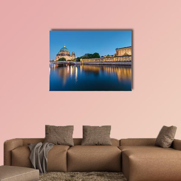 Museum Island at Dusk Canvas Wall Art in gold, orange and blue, single panel hung on a wall