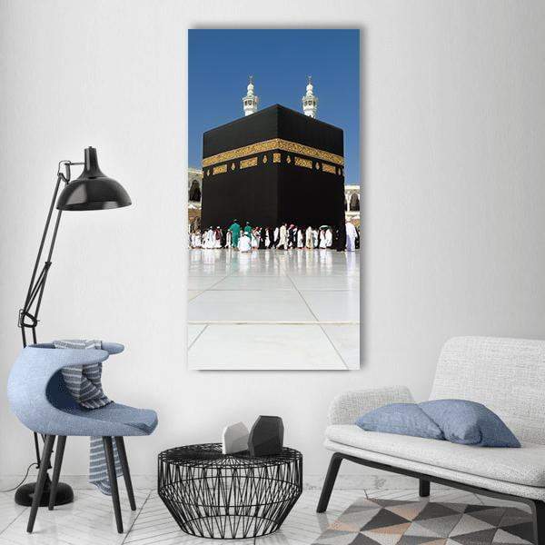 Kaaba at Al-masjid Al-haram Vertical Canvas Wall Art in black, white and blue, single vertical panel hung on a wall